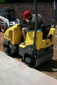 steam roller laying turf